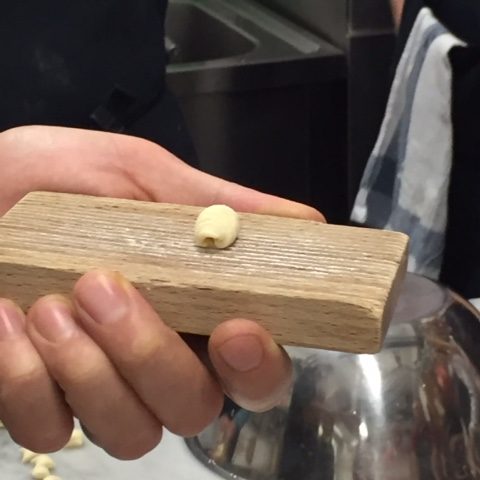 pasta being made in cooking class in rome italy