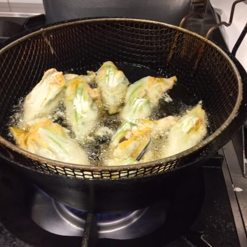 zucchini frying in a pan